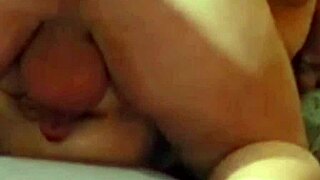 She's bent over getting her ass and pussy fucked while fingering and licking balls