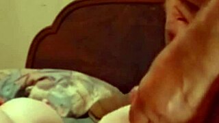 She's bent over getting her ass and pussy fucked while fingering and licking balls