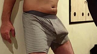 woman slaps man's cock and balls repeatedly