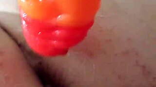 Chubby brunette uses rainbow dildo for anal gaping