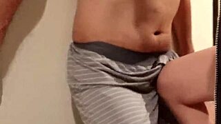 woman slaps man's cock and balls repeatedly