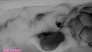 Kity Hudson Plays With Toy In Bath