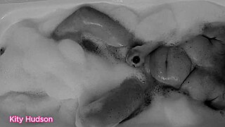 Kity Hudson Plays With Toy In Bath