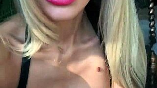 woman in wetlook suit and patent leather boots feels so sexy showing off her ass