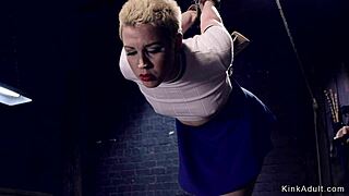 Hey, why’s this blonde slave in a gas mask getting whipped and fucked so rough?