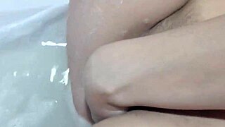 housekeeper bathes and masturbates her shaved pussy
