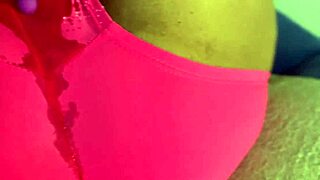 Ebony babe squirts through shorts while using vibrator