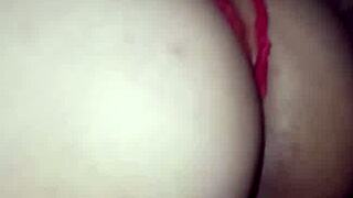 In red lingerie, the prostitute gets covered in cum during the swingers' group session.