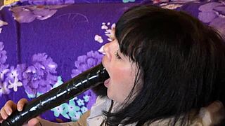 I, a milf in a down coat, suck a big dildo in different positions, it's so sexy