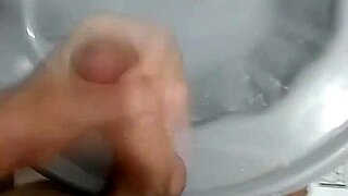 Jerking off in the bathroom after soccer game, solo amateur moment