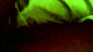 Ebony woman performs a professional striptease on stage.