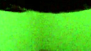 Ebony woman performs a professional striptease on stage.