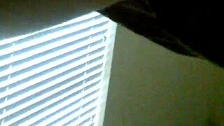 Ebony woman performs a professional striptease on stage.