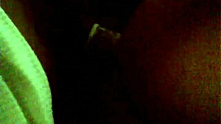 Ebony woman performs a professional striptease on stage.