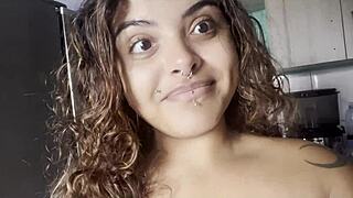 Look at this curvy amateur drinking coffee naked with big breasts, talking to the camera about her soft body.