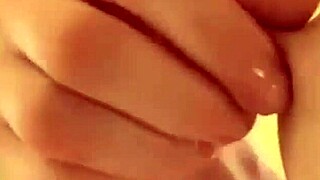 Allie rubs her beautiful breasts and a beautiful pink nipple