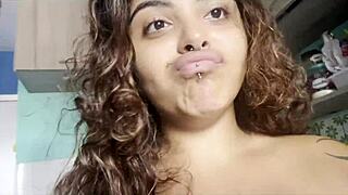 Look at this curvy amateur drinking coffee naked with big breasts, talking to the camera about her soft body.