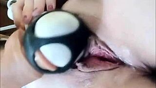 Woman uses large thick dildo to fuck her wet dripping pussy, ripping clothes in the process