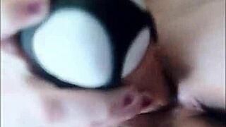 Woman uses large thick dildo to fuck her wet dripping pussy, ripping clothes in the process