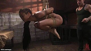 ebony slave endures rough whipping and bondage in suspension, tied up for deepthroat pain