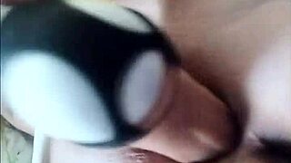 Woman uses large thick dildo to fuck her wet dripping pussy, ripping clothes in the process