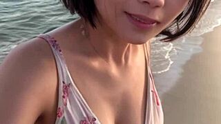 Mature woman strolls on the beach 😊