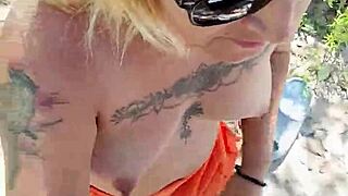Does this tattooed Mexican prostitute show tits and ass in public?