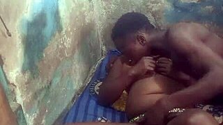 Fucking a black girl with massive breasts in a private setting