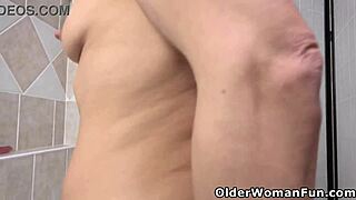 jane sweet, mature milf, works a dildo in steamy bath solo