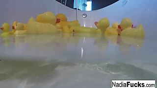 sexy nadia enjoys a relaxing bath with rubber duckies