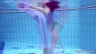 Aneta’s Big Tits Bounce in a Purple Dress While Diving Into the Pool