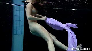 Aneta’s Big Tits Bounce in a Purple Dress While Diving Into the Pool