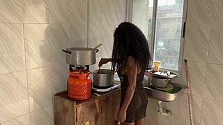 In the kitchen, she rides a big black cock until her pussy squirts