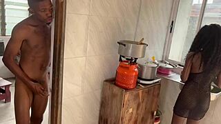 In the kitchen, she rides a big black cock until her pussy squirts