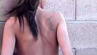 Mandy performs a striptease for the camera in bikini.