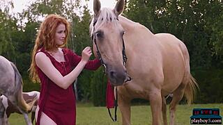 Gorgeous redhead milf poses outdoors