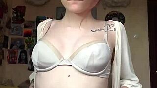 She removes underwear on camera, showing smooth pussy