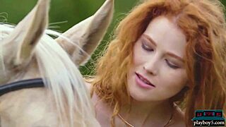 Gorgeous redhead milf poses outdoors