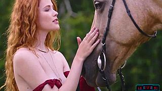 Gorgeous redhead milf poses outdoors