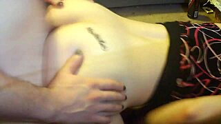 girlfriend gets down in front of the desk, showing her ass