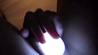 sleepless girl rubs clit with light in close-up solo