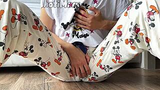 A skinny teen in pajamas masturbates to a squirting orgasm