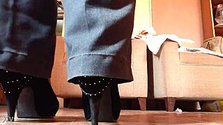 shemale struts in black high heels, teasing with every step