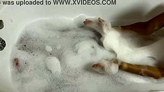 Brunette with small tits sings naked in the bath