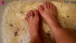 Skinny Tattooed Amateur Gently Washes Bare Feet with Rose Petals and Herbs in Homemade Video