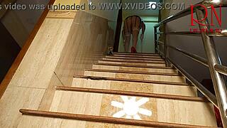 depraved maid cleans stairs in a large house.