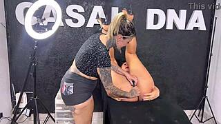 tattoo artist works on bodybuilder client in intriguing session