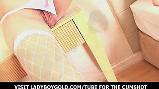 Asian ladyboy with nice curls teases with stiff cock in lingerie