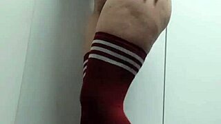 In the change room, a cheeky skinny babe tries on slutty tops topless and nude thigh high socks without panties.