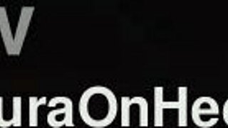 Milf Sits on Sofa in Leather Miniskirt with Stockings and High Heels